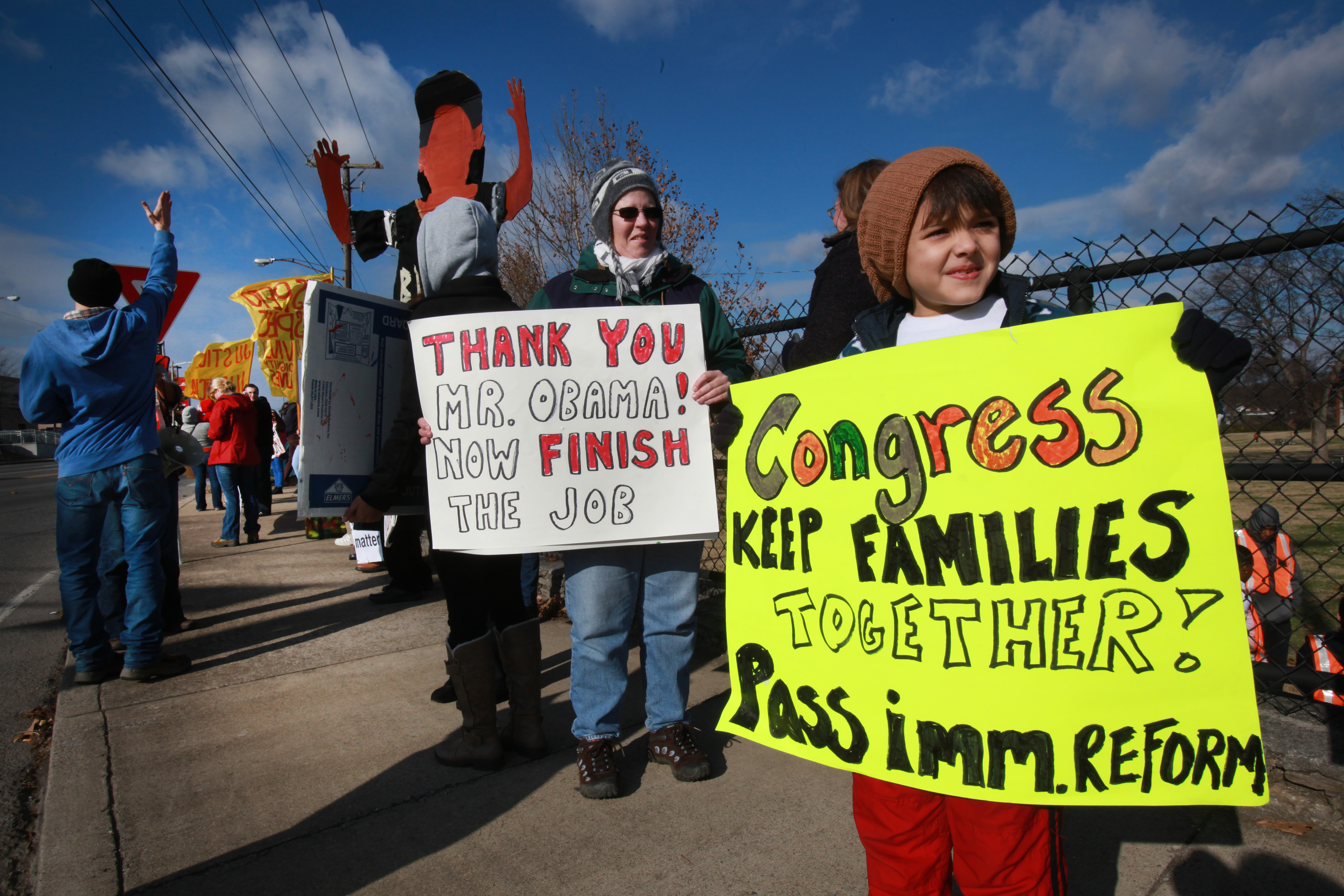 Chavin Medina, 8, traveled 165 miles with his mother, Alysa Medina, to show support for immigration reform. In the background is Mary Hutchings and others gathering in solidarity for racial justice on the afternoon that President Obama speaks on immigration in Nashville, Tennessee.