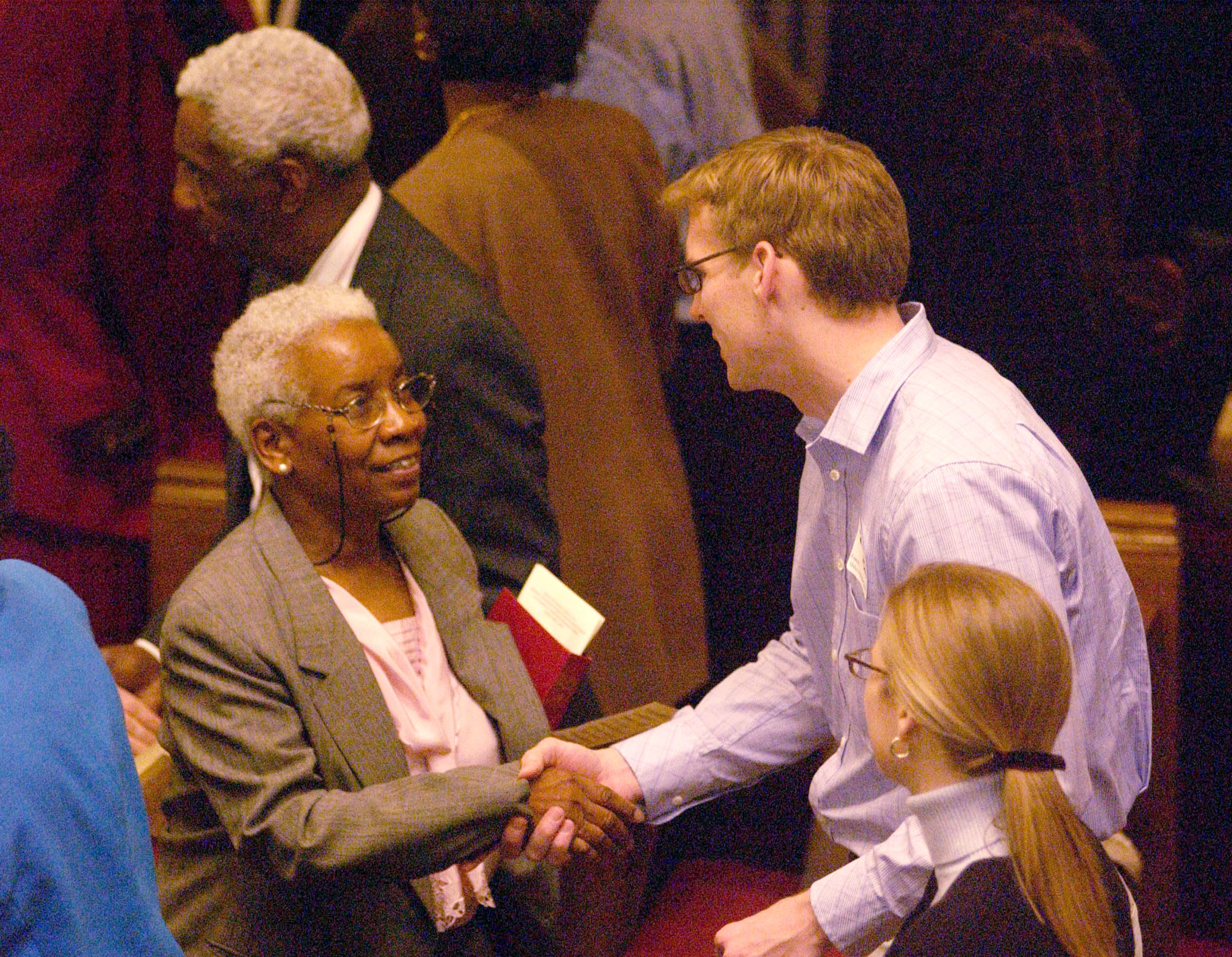 Parishioners of predominantly white Foundry United Methodist Church and predominantly black Asbury United Methodist Church in Washington greet each other during a 'service of confession and repentance.' A UMNS photo © Jay Mallin.
