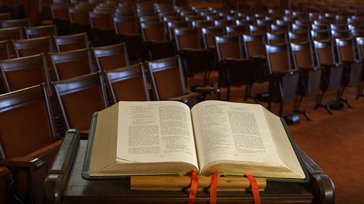 lovely-lane-bible-seats Scripture rests on a pulpit at Lovely Lane United Methodist Church in Baltimore, MD. Video image by United Methodist Communications.