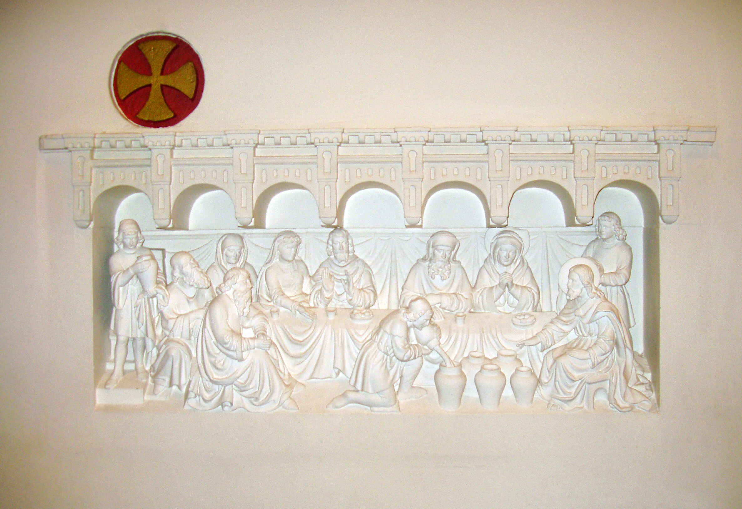A panel on the back wall inside of Joannes de Dooper Church in Pijnacker, Netherlands, depicts the wedding feast at Cana. Photo by Hpruxpbvm, courtesy of Wikimedia Commons.