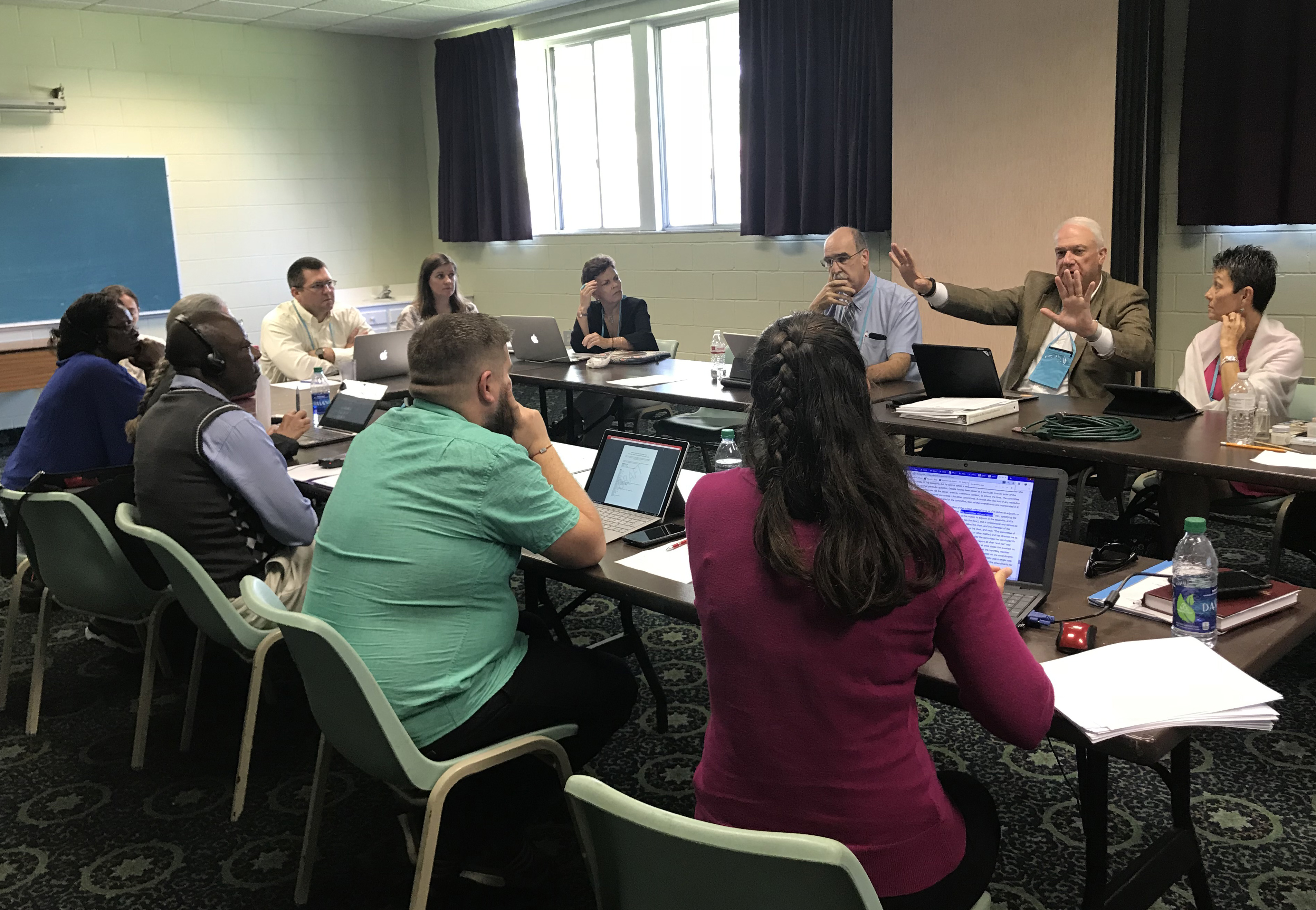 Members of the Rules Committee and Commission staff discuss a legislative structure for the 2019 Special Session of the General Conference. Photo by Diane Degnan, United Methodist Communications.