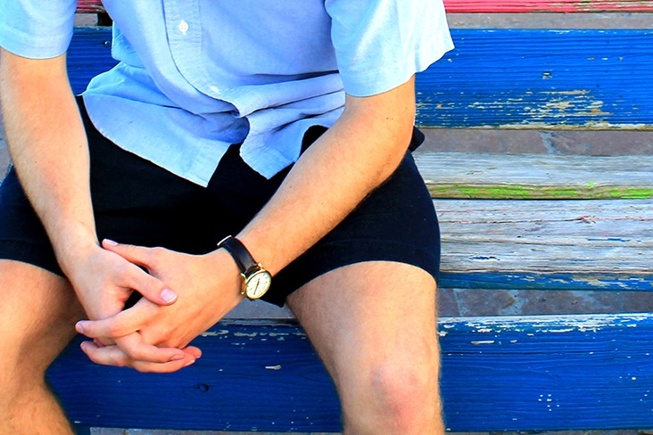 Man sits on bench with hands in prayer. Photo illustration by Kathryn Price, United Methodist Communications.