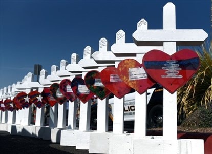 Crosses for each of the victims of a mass shooting in El Paso, Texas, being assembled before being taken to a memorial site. Photo courtesy of Reuters as provided by the Council of Bishops.