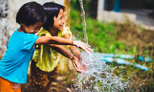 Children playing in clean water.