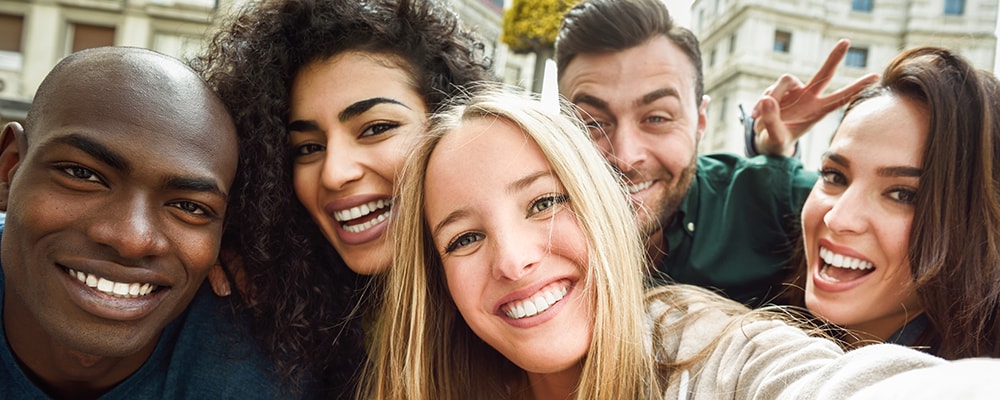 Group of young people taking a selfie.