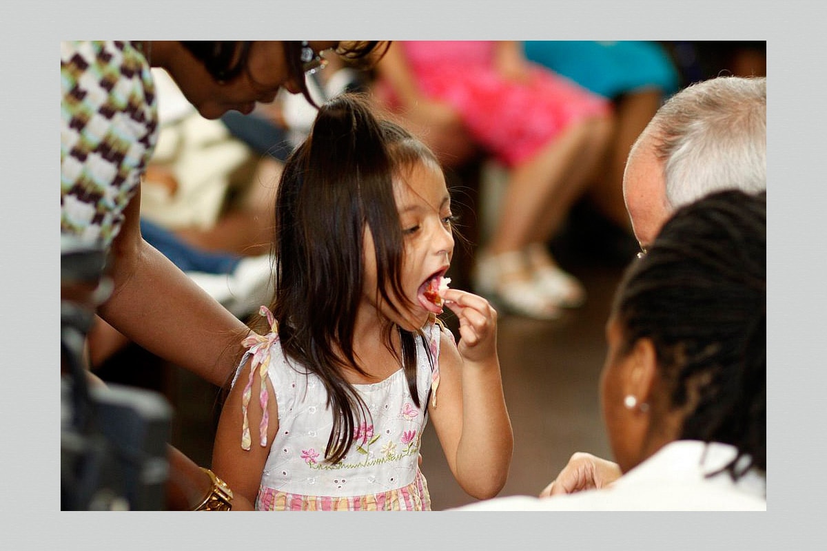 A child takes communion at First Grace United Methodist Church in New Orleans, Louisiana. Photo by Kathy L. Gilbert, UM News.