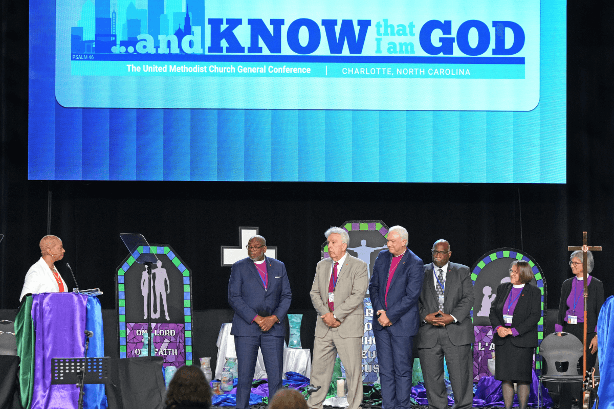 New COB President Bishop Tracy S. Malone introduces the COB leaderships team during the General Conference in Charlotte, N.C. From left, Bishop L. Jonathan Holston (Secretary), Bishop Ruben Saenz (President-Designate), Bishop Thomas J. Bickerton (Past President), Bishop Gregory V. Palmer (Executive Secretary), Bishop Rosemary Wenner and Bishop Hope Morgan Ward (Co-Ecumenical Officers).