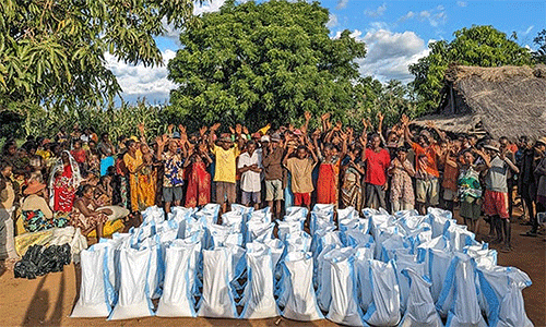 Community members from Andranokaky, Madagascar, celebrate the food and other supplies distributed by The United Methodist Church in Madagascar. Extended drought and flooding has created food insecurity in the region. Photo by Justin Rakotoarimanana.