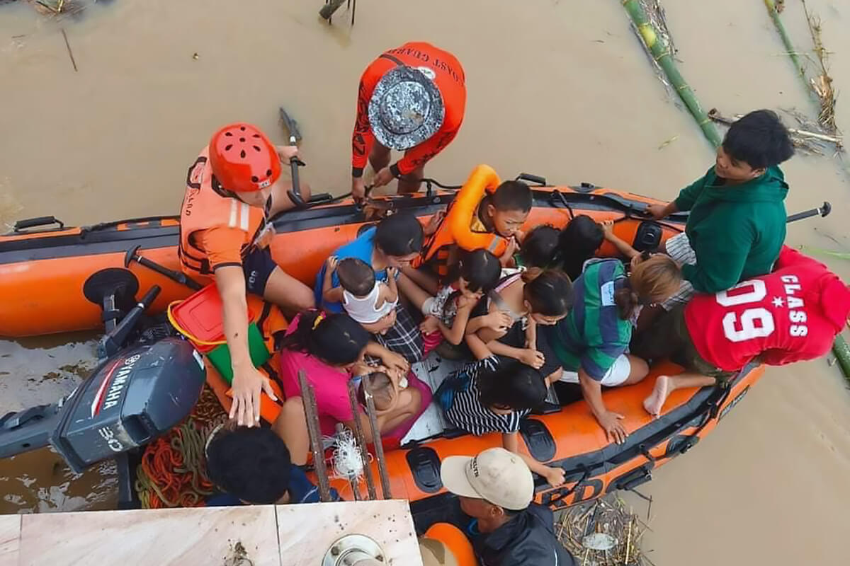 Philippine Coast Guard personnel evacuate residents in the Bicol region on Oct. 24 after floodwaters rose quickly due to heavy rains brought by Tropical Storm Trami (called Kristine in the Philippines). United Methodists are among those rallying to help survivors in the wake of Trami and several other tropical storms that battered the region. Photo courtesy of the Ako Bicol Online TV Facebook page.
