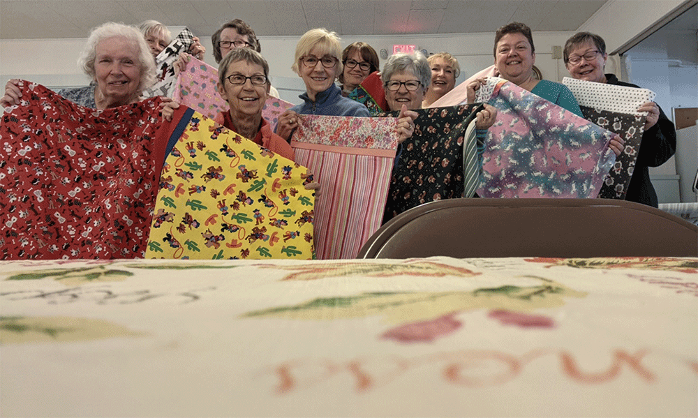 Oakdale UMC volunteers showcase pillowcases before delivering to children with cancer. Courtesy photo.
