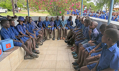 Schoolchildren from the United Methodist Chikwizo Primary School await their turn to get polio vaccines at Chikwizo rural health clinic in February. Polio is a killer disease affecting children under 10 years old. According to the World Health Organization, Zimbabwe is part of the Global Polio Eradication Initiative and has sustained high vaccination coverage with over 90% of children receiving vaccines. Photo by Eveline Chikwanah, UM News.